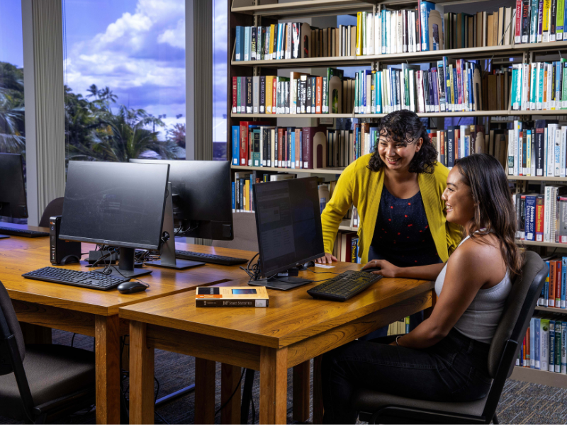 Student and Teacher in Library at HPU