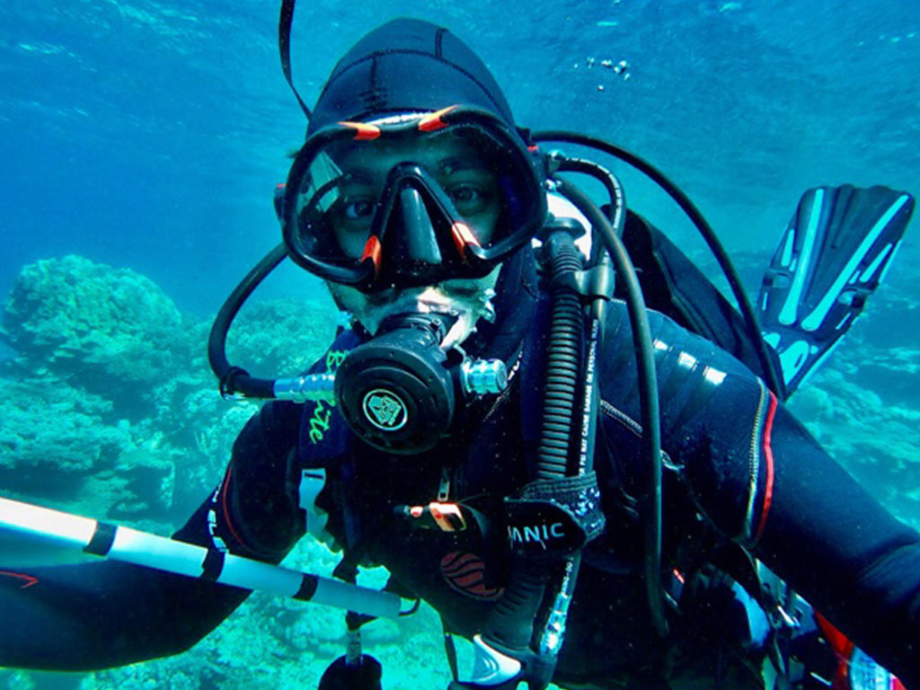 Ahmed conducting fieldwork in Oman