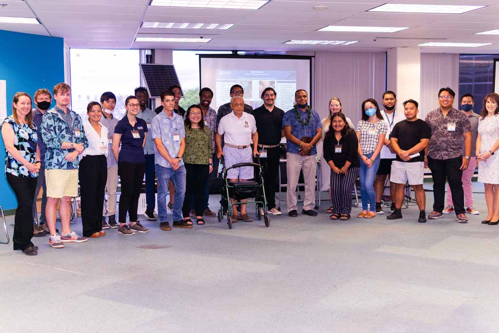 Suketu Naik, Ph.D., the 2022 HPU Teacher of the Year, is congratulated by his students in the HPU Allen and Nobuko Zecha Engineering Program, Allen Zecha, Ph.D., and HPU administrators