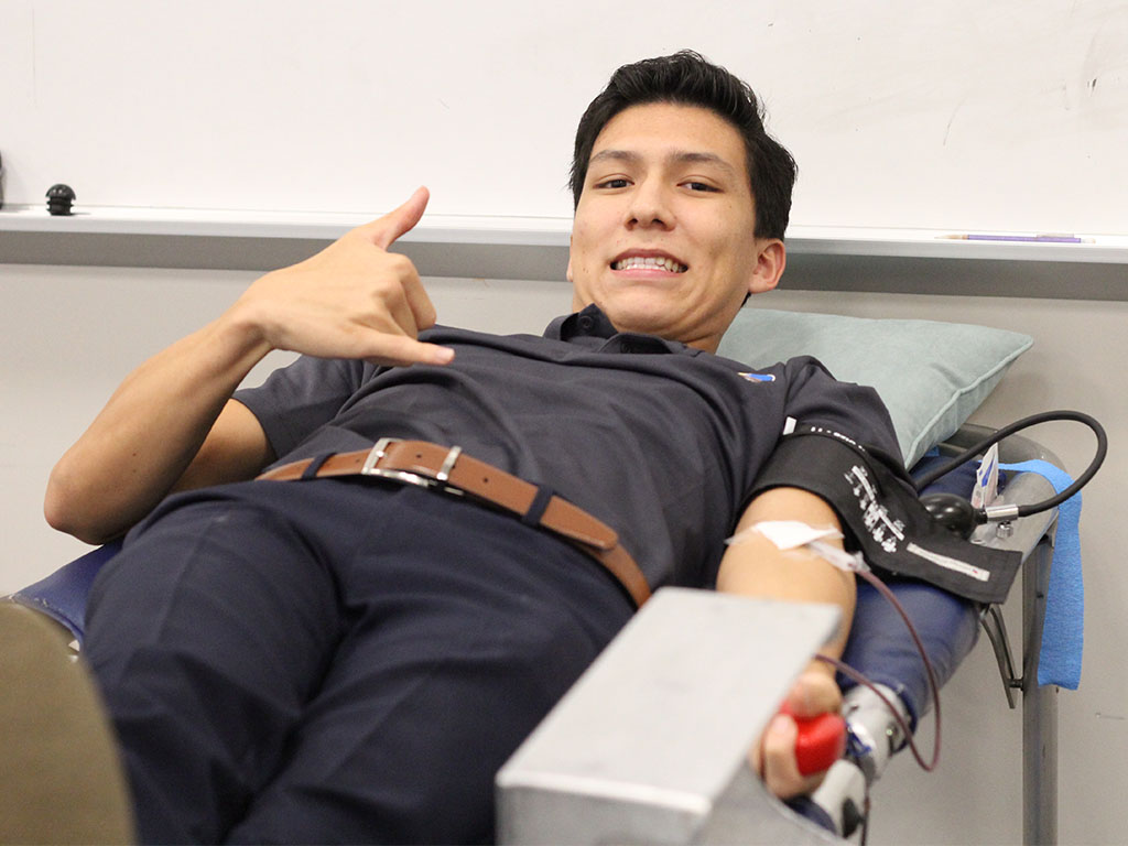 HPU student Blaise Babineck gives blood
