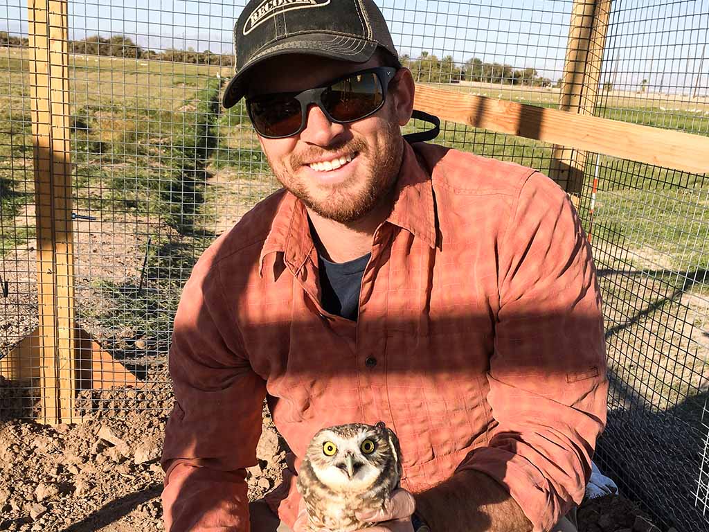 Jake Hargis with a burrowing owl at Sonny Bono National Wildlife Refuge, Calipatria, California