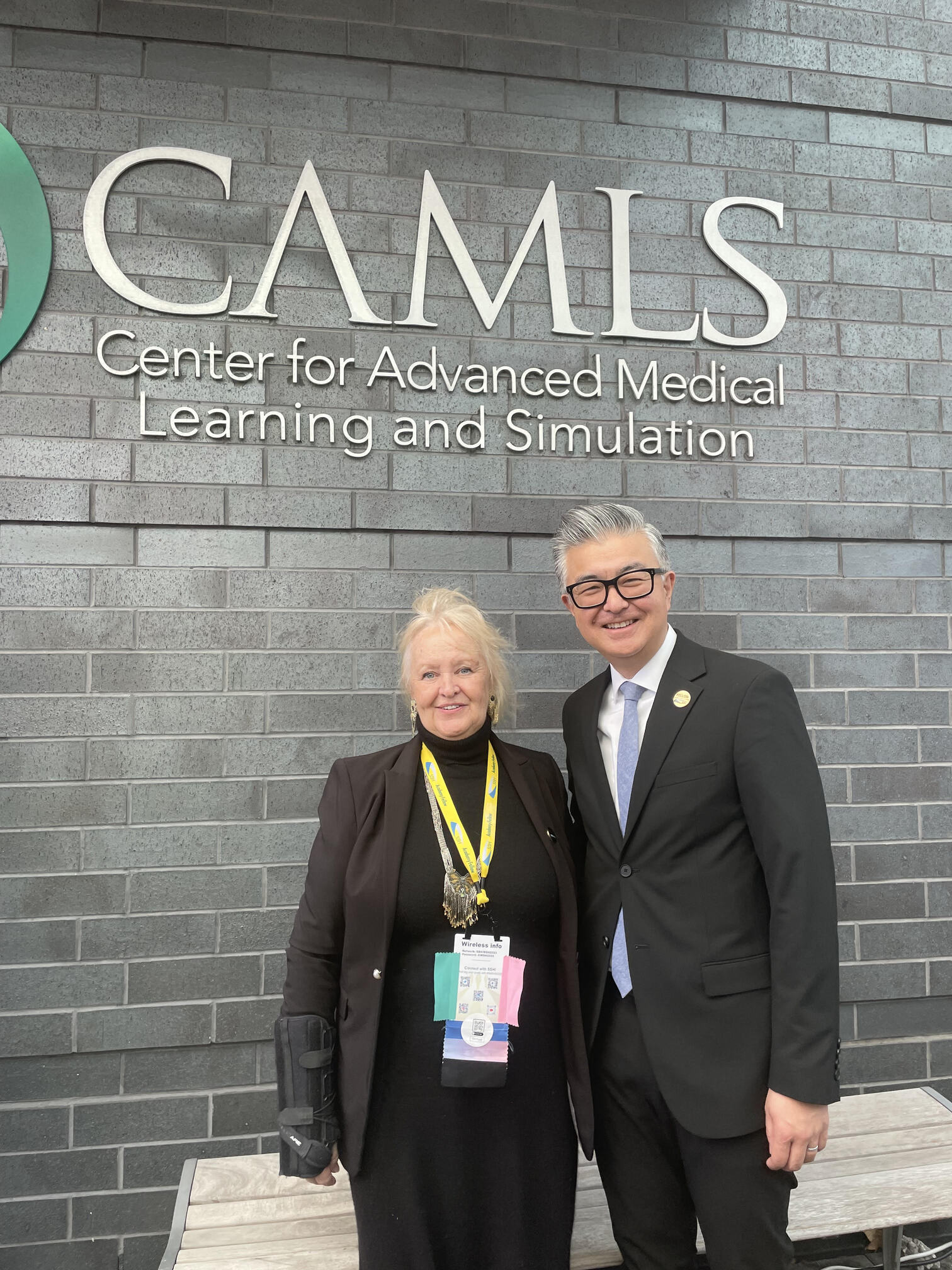 Dr. Jayne Smitten and the past SSH President Dr. Haru Okuda from Tampa, Florida, in front of the extraordinary 90,000 sq ft CAMLS Sim Center.