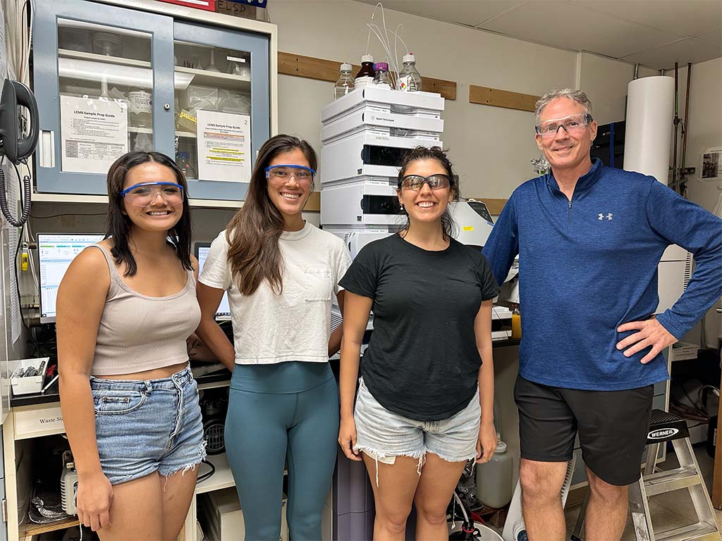 HPU research technicians (left to right) Jessie Nguyen, Ellis Akana, Simone Duran-Nyers with David Horgen in an HPU laboratory