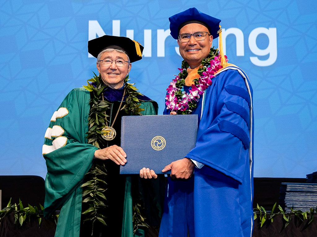 President John Gotanda and Joel Bauzon at the HPU spring 2023 graduation ceremony