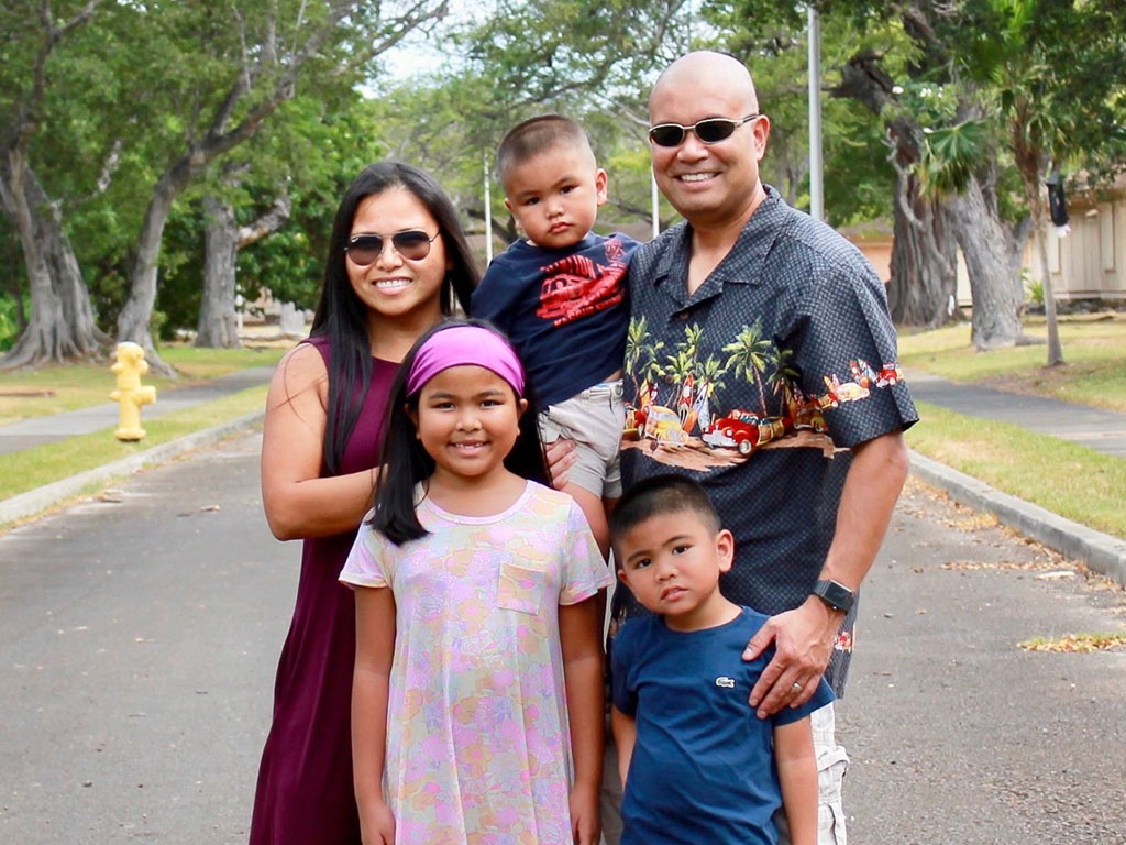 HPU alumnus Joel Bauzon with his family