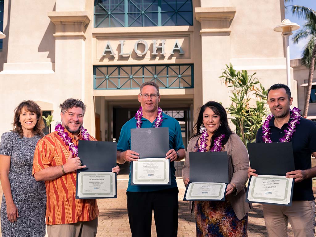 Golden Apple Award winners with Provost Jennifer Walsh (far-left) at Aloha Tower Marketplace: (left to right) Matthew LoPresti, Harm-Jan Steenhuis, Joelle Phillips, Ghazwan Hassna