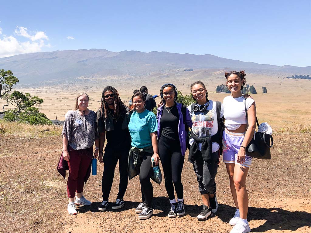 HPU attendees at Pu'u Huluhulu with Mauna Kea in the background (left to right): Barbara Quimby, Solomon Hayes, KaiLei'a Duriano, Allison Nims, Xenia Barnes, Nawel Hamroun