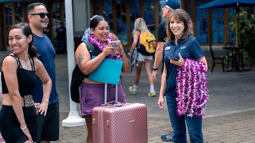 HPU Provost Jennifer Walsh with new students and families on move-in day at Aloha Tower Marketplace