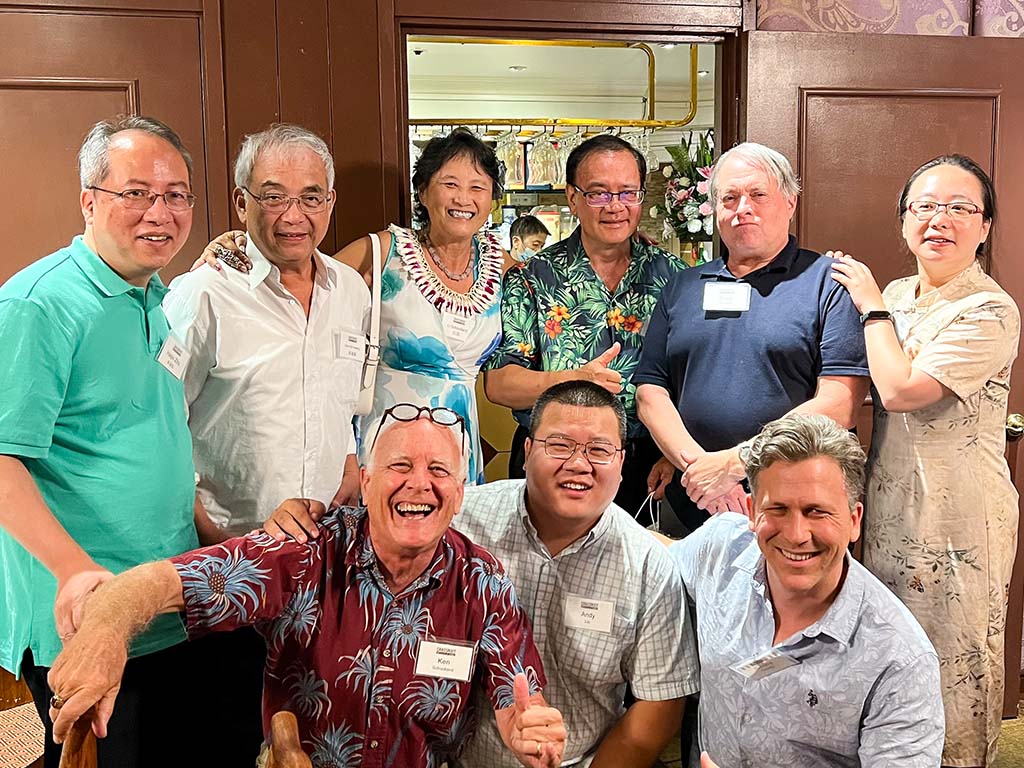 Ken Schoolland (bottom row, far-left) and Gerard Dericks (bottom row, far right) presented at the economics conference held at Waterfront Plaza