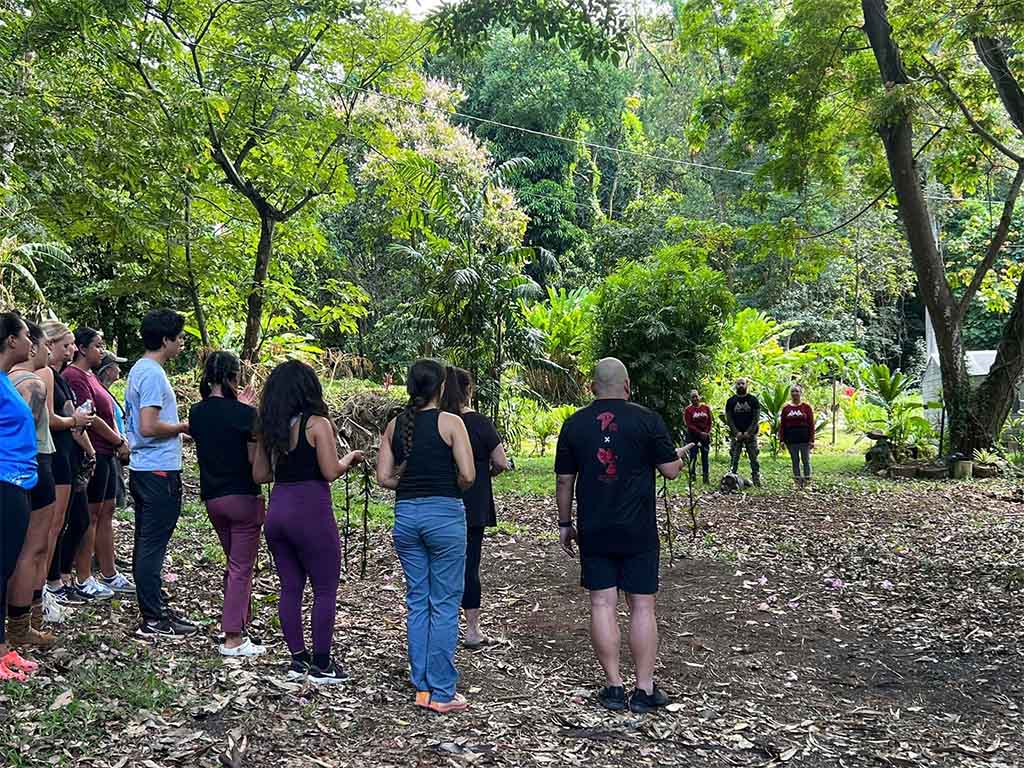 School of Social Work 'ohana participate in a cultural protocol activity 