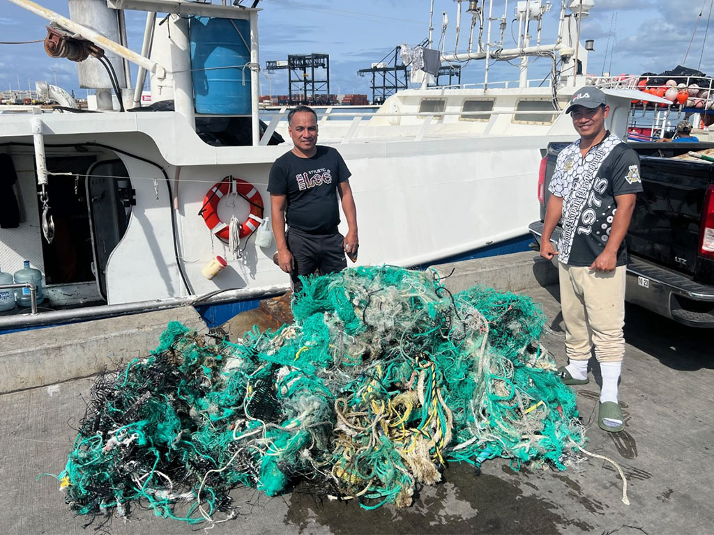 Crew, who are members of the Hawai'i Longline Association, with their derelict fishing gear that they removed while at sea. This gear weighed 169 pounds