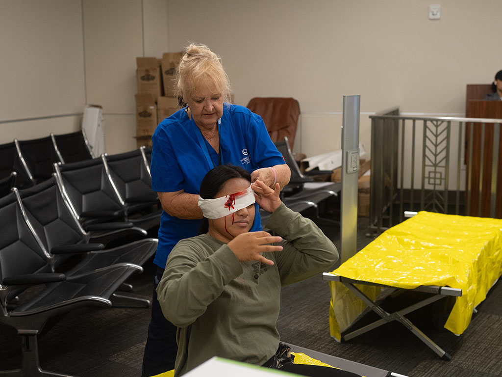 HPU public health students volunteered to portray injured passengers in an aviation disaster