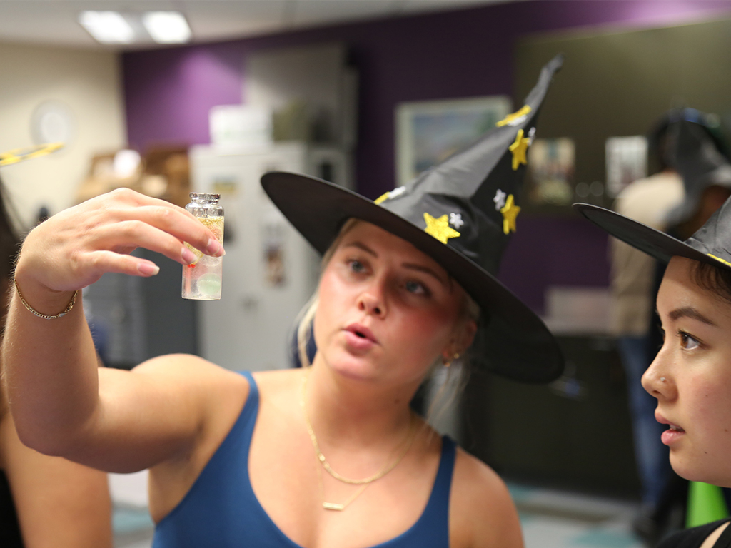 HPU school of education students observe a potion made in the classroom