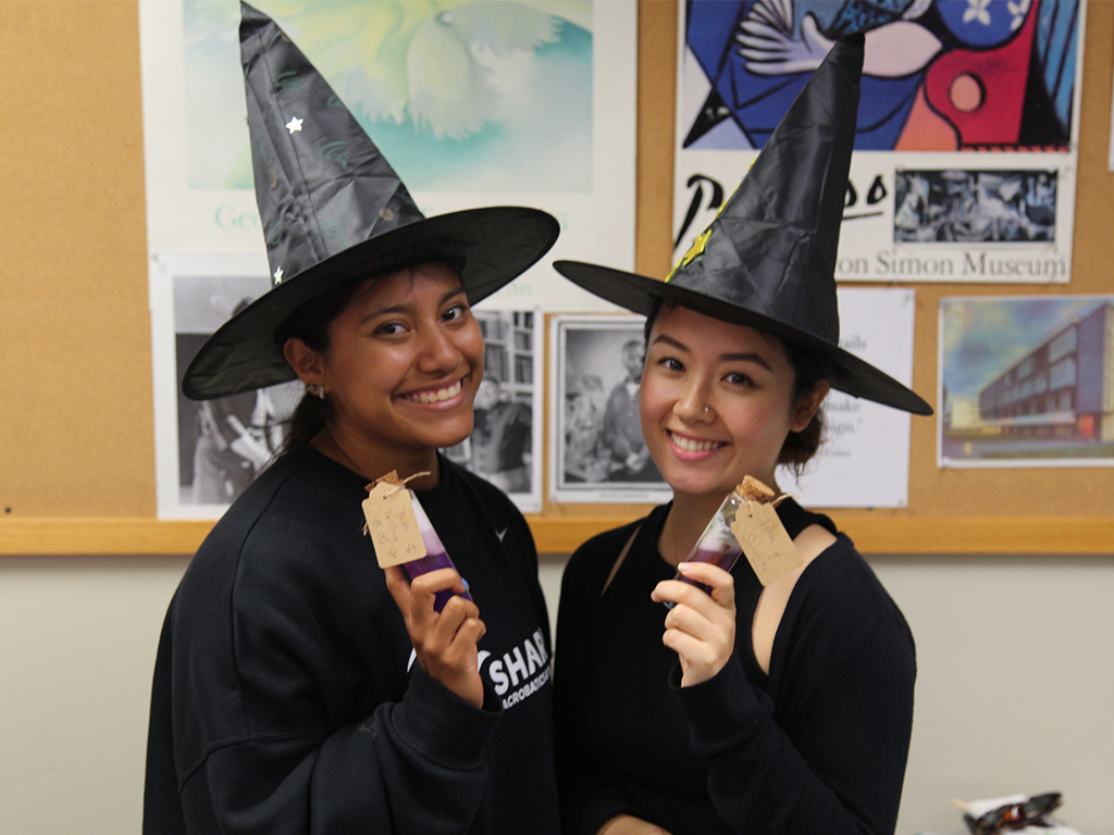 HPU school of education students with their potions created in the classroom