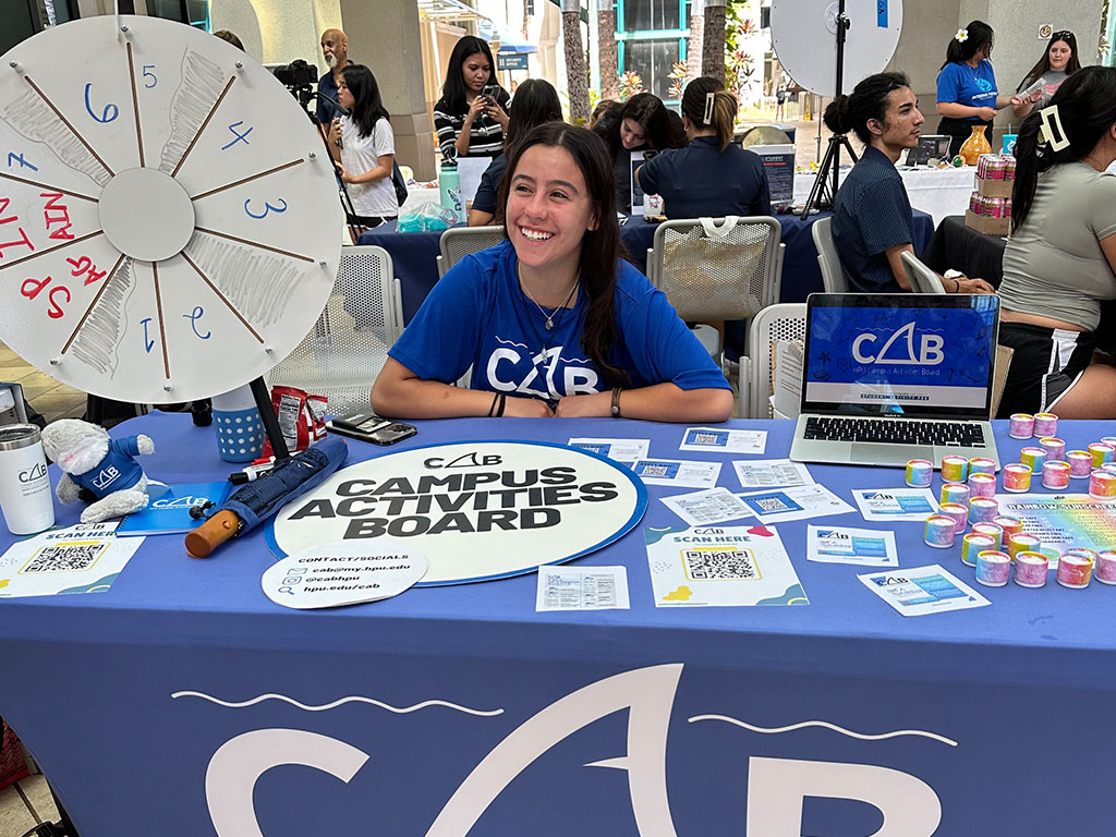 Marisol Castillo sharing information at the Campus Activities Board table at Club Carnival. A real full-circle moment, as Castillo first heard about CAB at Club Carnival when she first decided to join the group