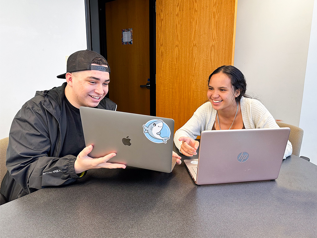 HPU students Orion Hefling and Aileen Kekumu collaborate on an assignment in the Ho'oko offices