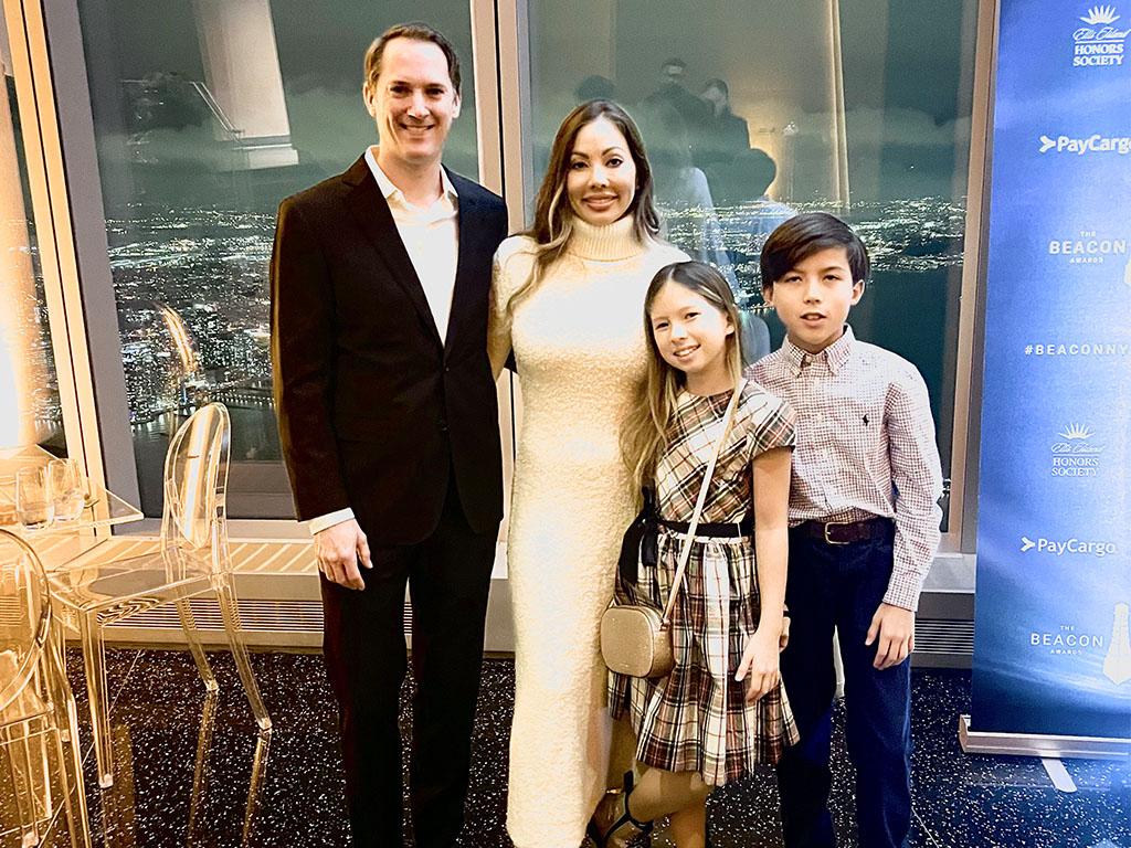 Sarah McFarland with her family at the Beacon Award ceremony in New York City