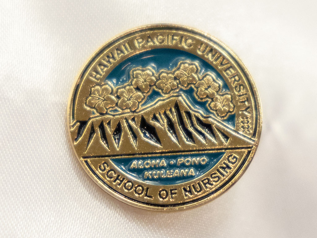 The newly redesigned pin encapsulates elements that symbolize the HPU School of Nursing
