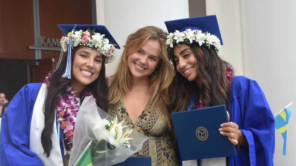 Ella Berge (center) with her roommates Caroline Gomes and Lena Nalchigar, at HPU's 2023 Spring Graduation. Photo provided by Ella Berge