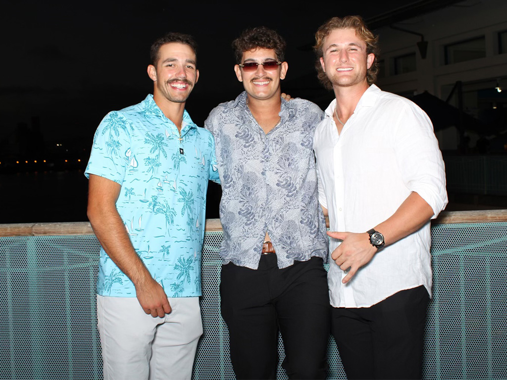 Chase Taylor (right) with teammates Cooper Donlin and Daniel Johnson at HPU's First Pitch Pa'ina