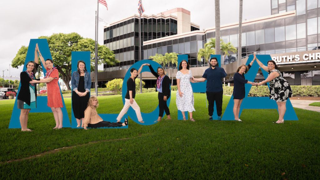 Sarah Blaylock, Ph.D., OTR/L, Assistant Professor, Occupational Therapy Doctorate Honolulu Program (second from left) and her OTD colleagues at Waterfront Plaza, home of the Graduate College of Health Sciences lab