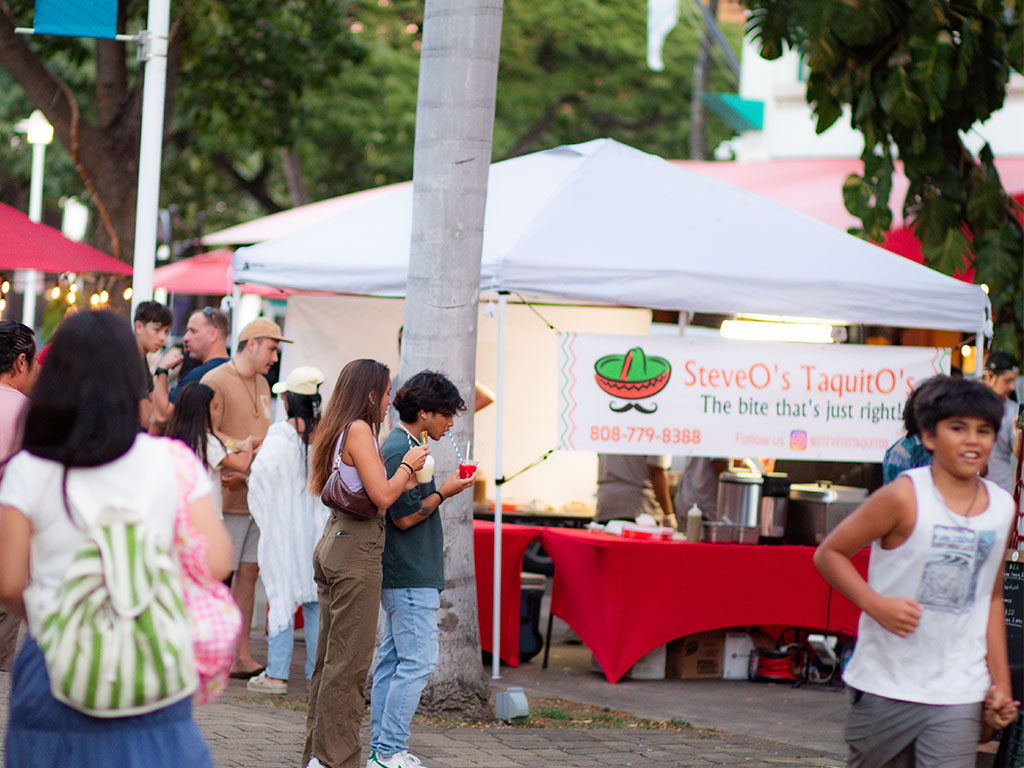 Food trucks and activities for children are featured at the night market