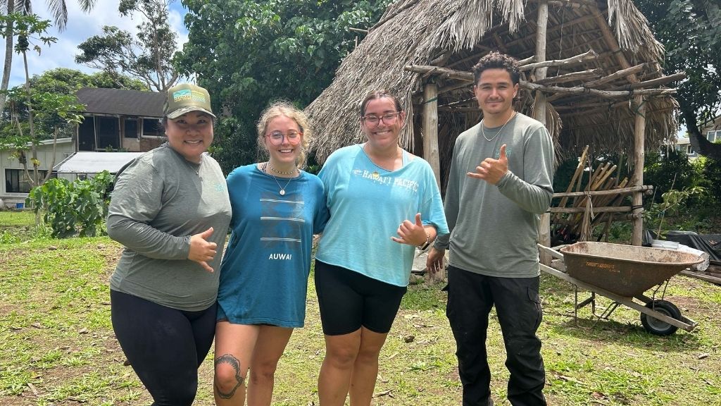 From left to right: Lauren Fukuda, Director of Philanthropy for the Hawaiʻi Land Trust, Emma Stanley and Megan Ciluffo Sharks United Co-Presidents, and Makani Walker, the Maunawila Steward and Educator