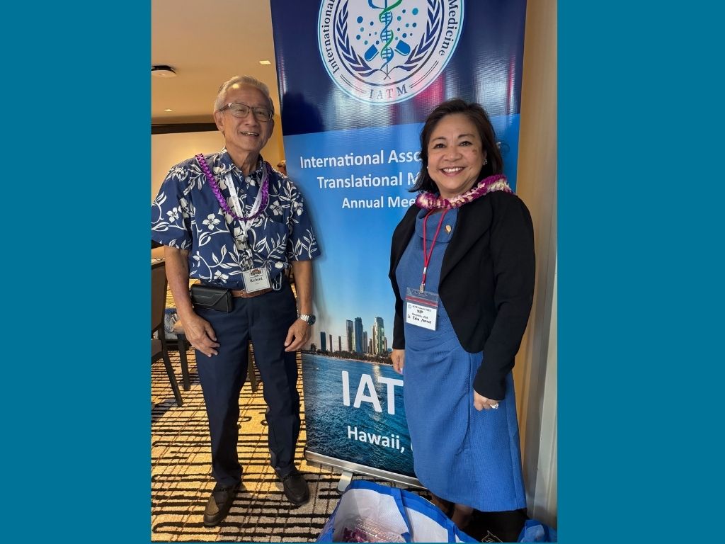 Dean Edna Magpantay-Monroe with Richard Lim at the International Association of Translational Medicine Conference
