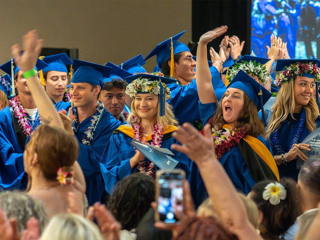 HPU graduates celebrate earning their degrees at a graduation ceremony at the Hilton Hawaiian Village Waikiki Beach Resort