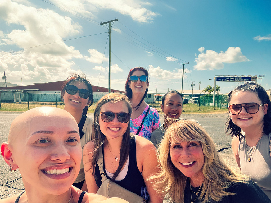 HPU OTD students with faculty members posed for a selfie, moments after their arrival in St. Lucia