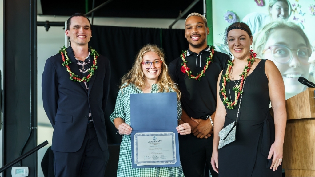 Community Advisor Emma Stanley receives the Resiliency Award (Housing and Residence Life). She is joined by staff Daniel Traylor, Dakota Jackson, and Vanessa Tackman