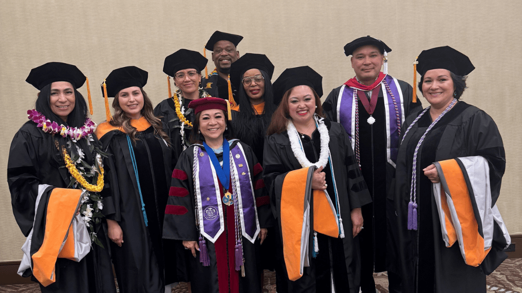 Spring 2025 DNP graduates with Drs. Vincent Pair (back, far right) and Edna Magpantay-Monroe (front, third from the left)