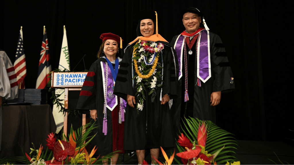 Following the ceremonial hooding, DNP graduate Lorena Cannon stands with the School of Nursing Dean Dr. Magpantay-Monroe and faculty member Dr. Pair, marking the completion of her academic journey
