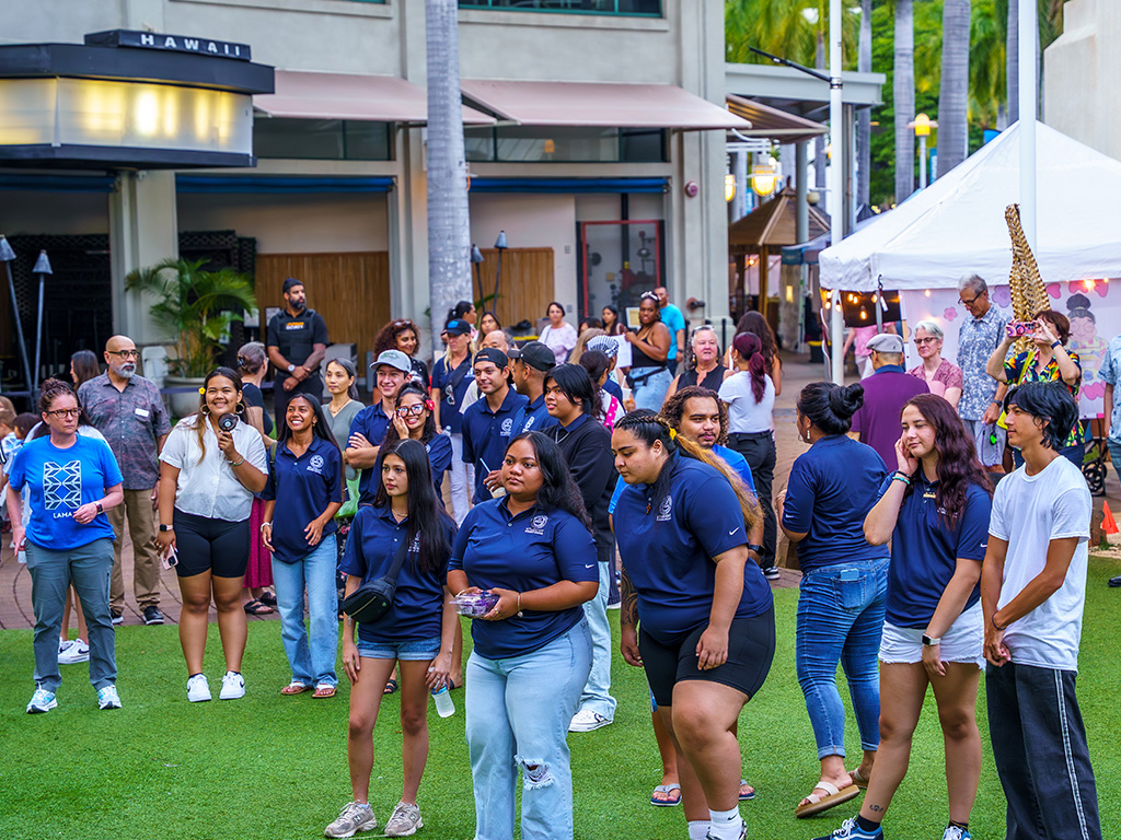 Hundreds of attendees gathered at Aloha Tower Marketplace near the harbor, getting ready for the show