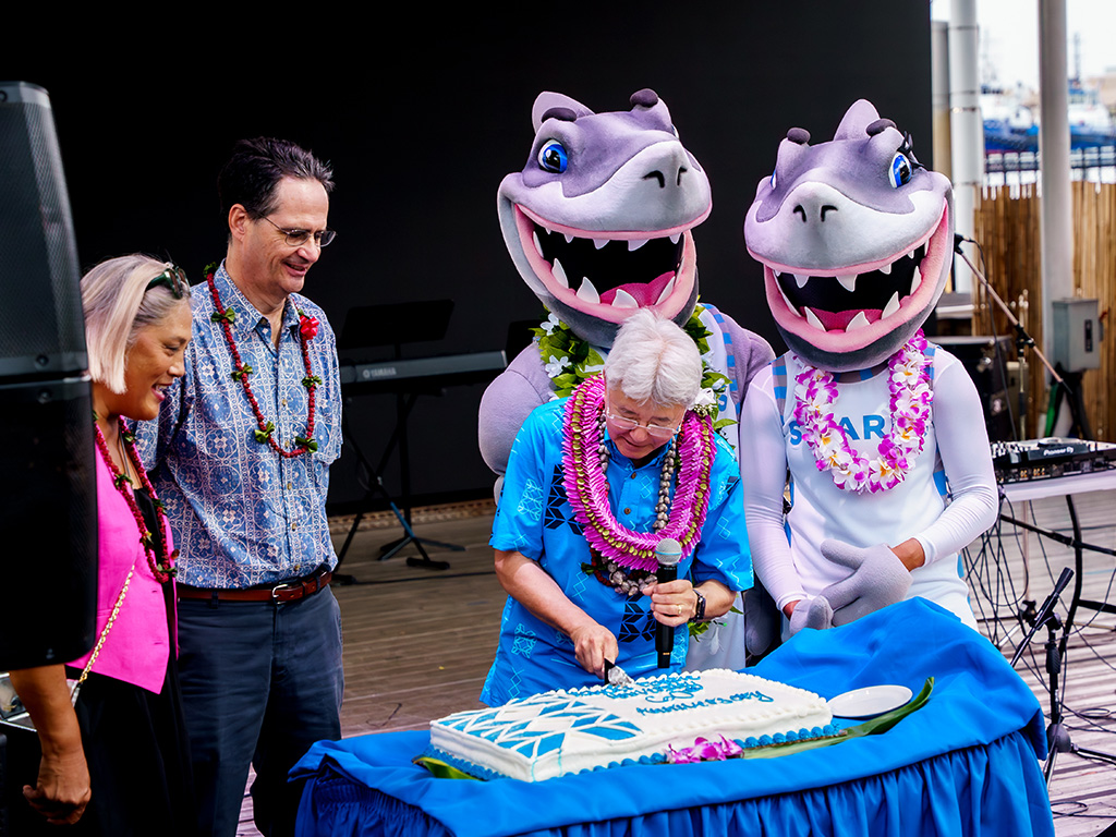 Senator Rhoads and Representative Iwamoto joined HPU President John Gotanda on stage for the cake cutting
