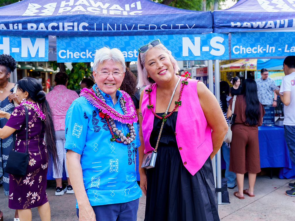 Hawai'i Representative Kim Coco Iwamoto attended the event (seen right), pictured with HPU President John Gotanda