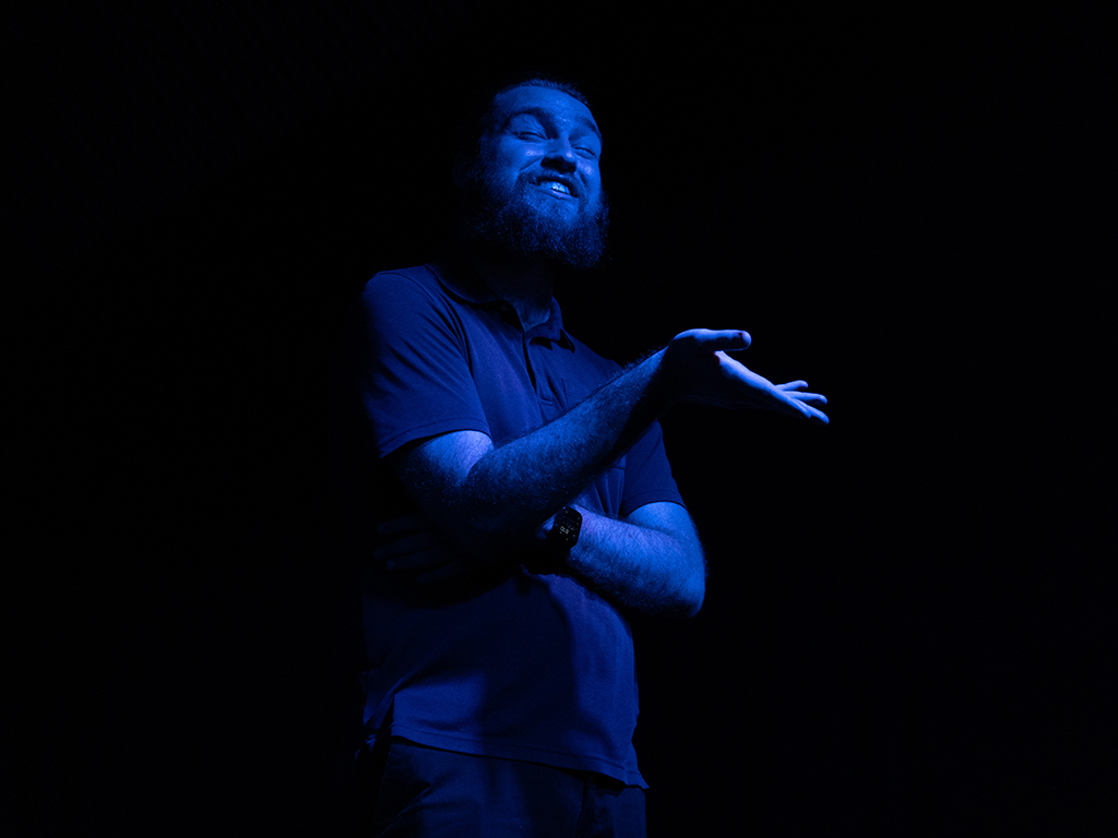 The production was staged under dramatic and often moody lighting