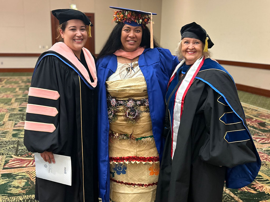 Atalina Pasi (Master of Public Health '24) receives the MPH Rising Star Award, honoring outstanding achievement, leadership, and dedication to advancing public health; she is pictured (middle) with PH faculty Erika Collazo-Vargas (left), Ph.D., and Jayne Smitten, Ph.D., at HPU's December 2024 graduation ceremony