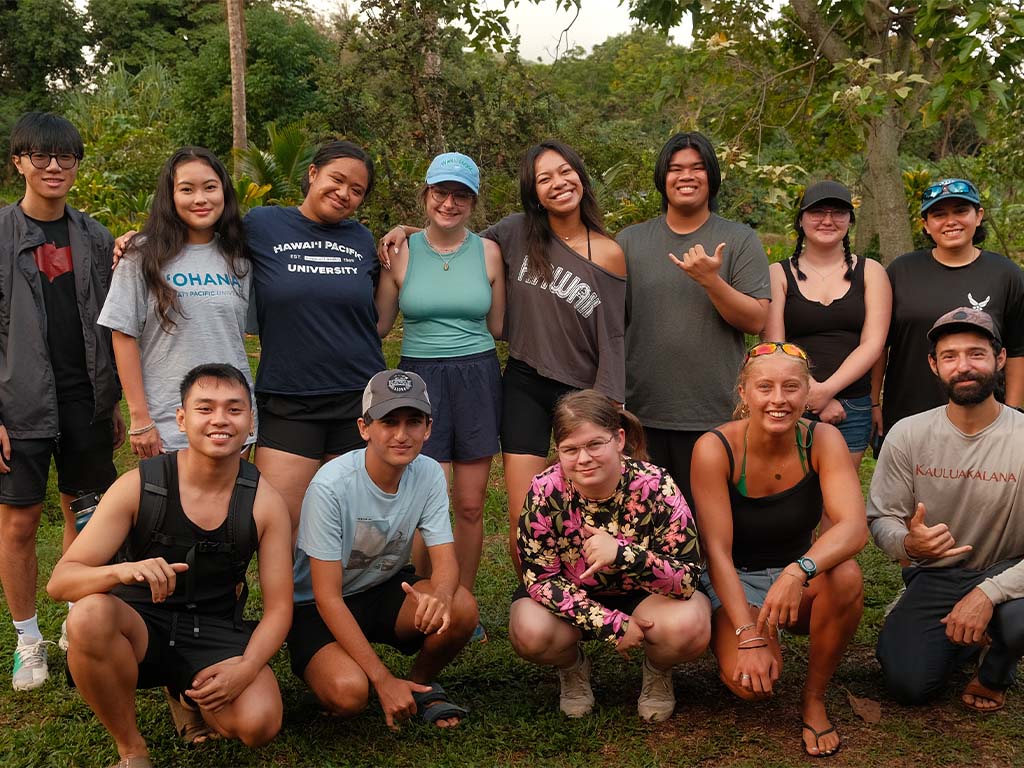 HPU students pictured at the kick off of the 'Beyond the Cap' service day before they got into the mud