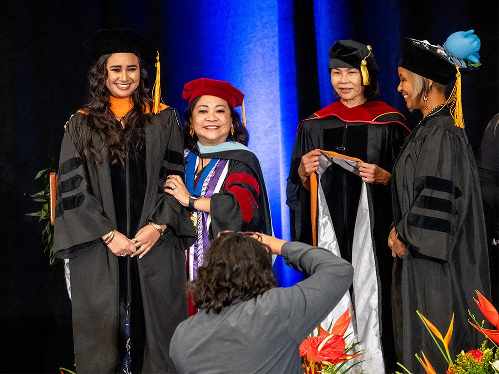 HPU Dean of the School of Nursing Edna Magpantay-Monroe with an HPU graduate