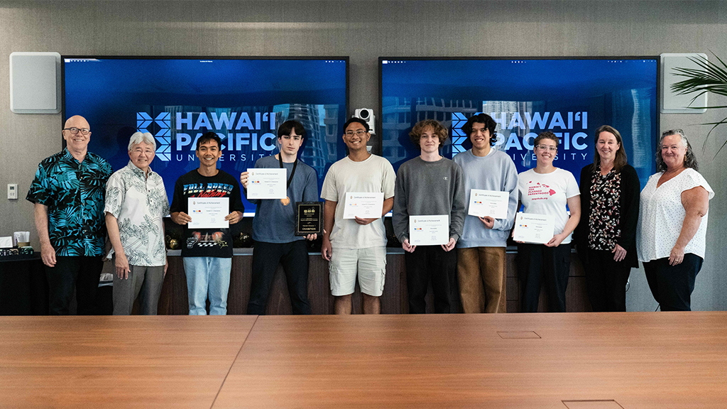 Left to right: HPU Associate Professor Curt Powley; HPU President John Gotanda; winning HPU international collegiate programming team members John Marcos, Pierre Erard, Adriane Fiesta; other competing team members Joshua Leonard, Matthew Holck, and Keʻalohi Young; HPU Acting Provost Brenda Jensen; and HPU Acting Dean of the College of Natural and Computational Sciences Carrie Jones