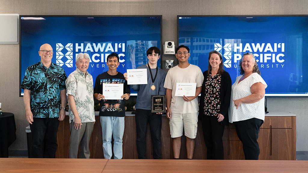 HPU Division I First Place team #0000FF, pictured left to right: HPU Associate Professor Curt Powley; HPU President John Gotanda; team members John Marcos, Pierre Erard, and Adriane Fiesta; HPU Acting Provost Brenda Jensen; and HPU Acting Dean of the College of Natural and Computational Sciences Carrie Jones