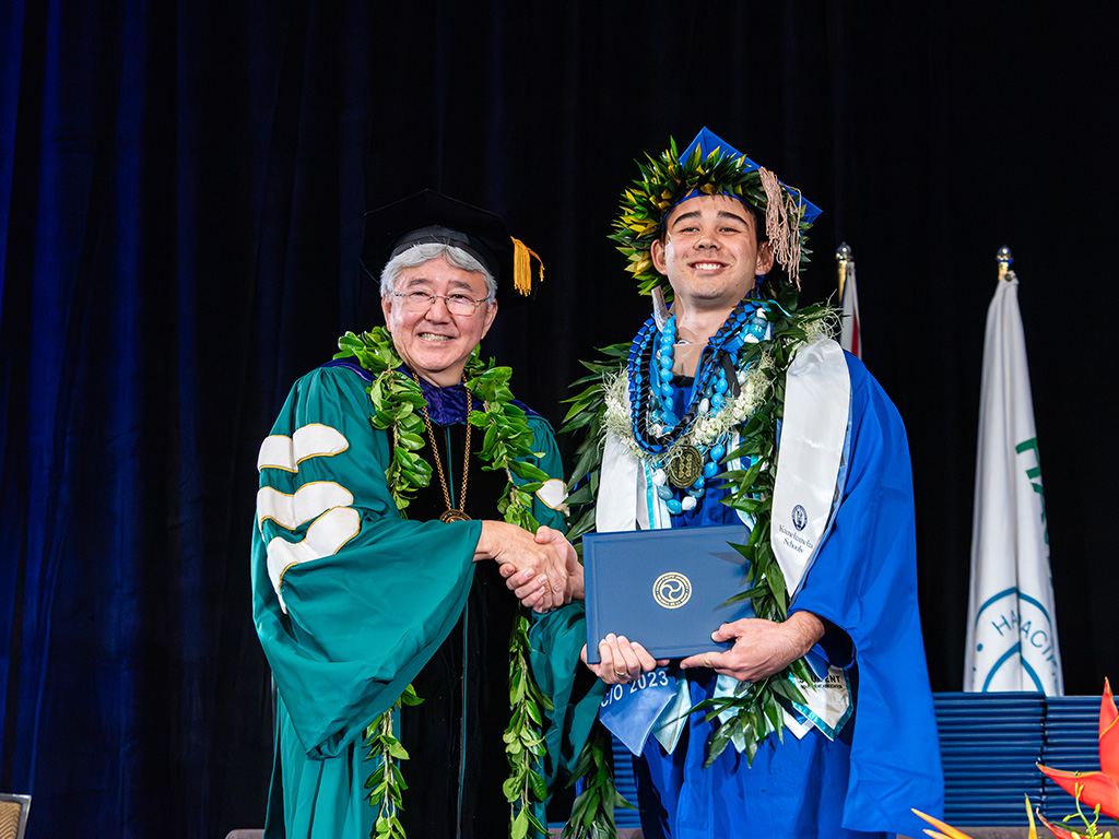 HPU President John Gotanda and an HPU graduate