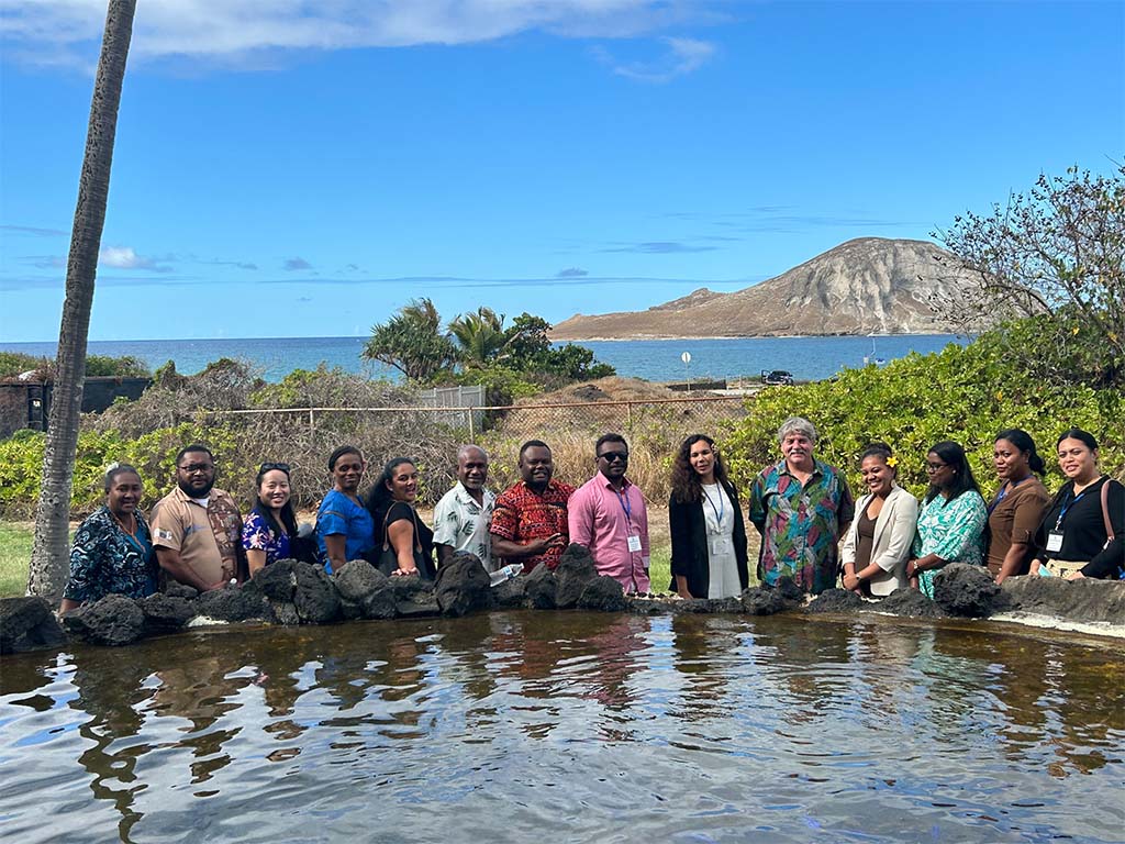 Shaun Moss, Ph.D., (fifth from the right) with the IVLP participants who visited OI