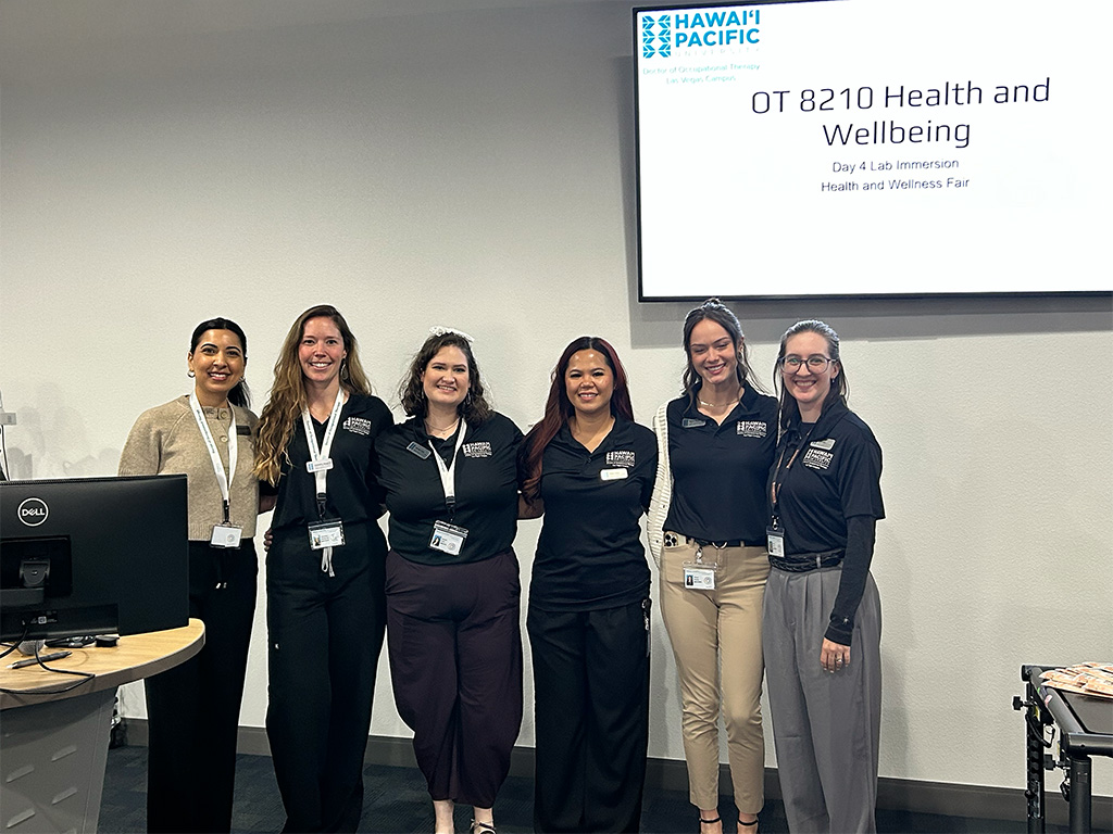Occupational therapy students at a lab immersion health and wellness fair