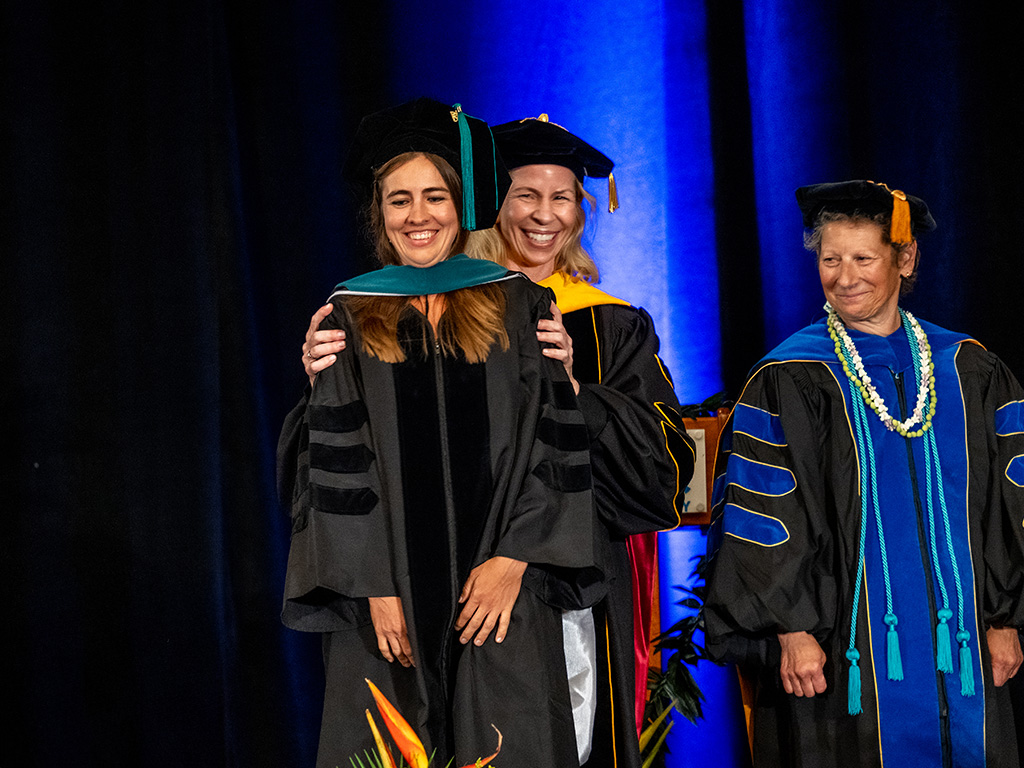 HPU Dean of the Graduate College of Health Sciences Tricia Catalino with an HPU graduate