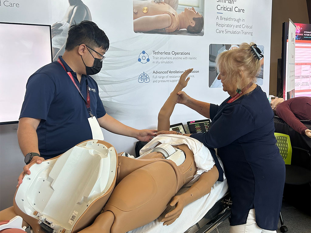Jayne Smitten, Ph.D., M.Ed., CHSE-A, FSSH, participating in simulation exercise exhibit