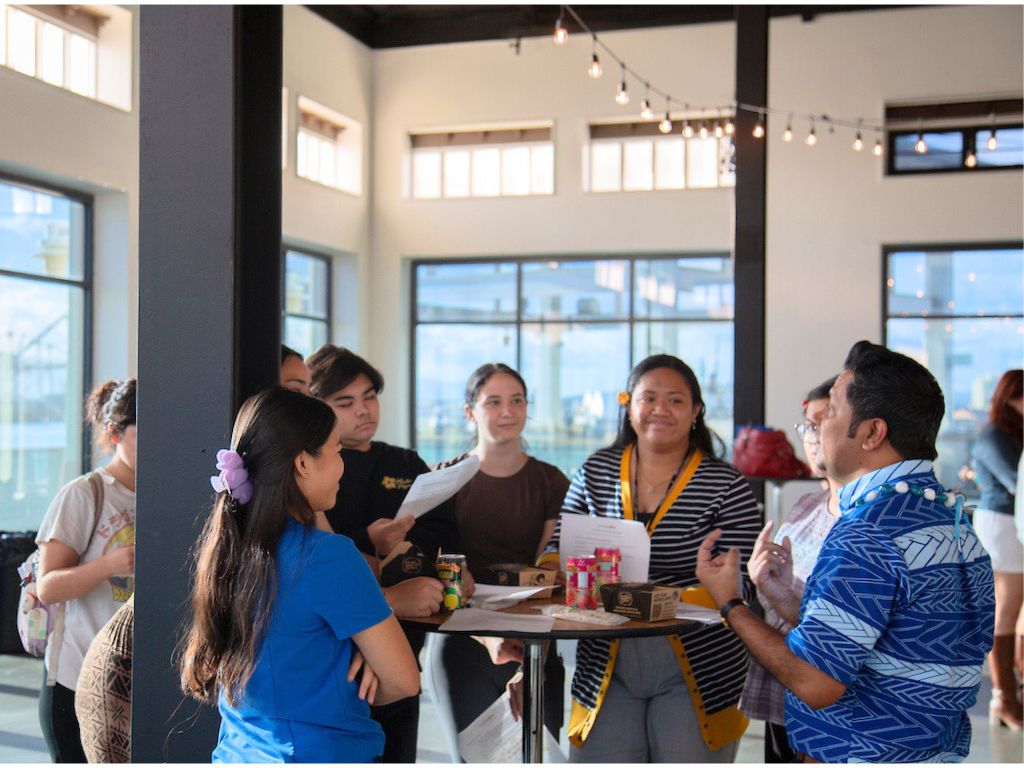 President of Finance Insurance Ltd. Joy Barua (far right) leads his student networking group session