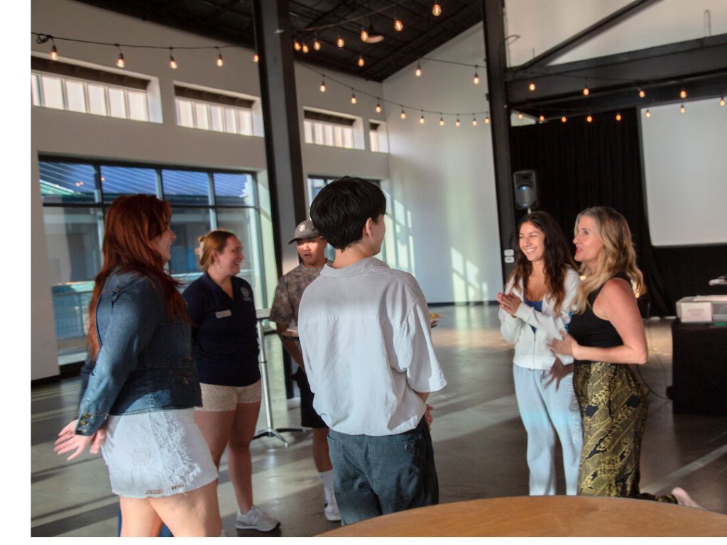 Founder and CEO of Pacific Edge Media Group Naomi Hazelton (far right) leads her student networking group session