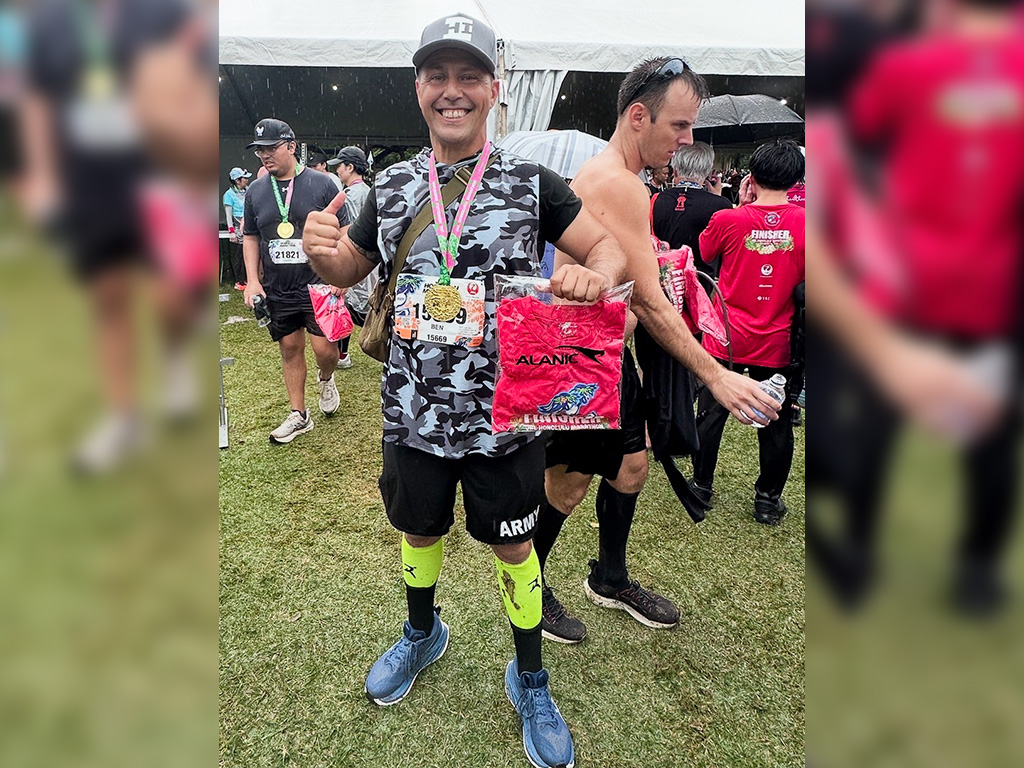 Ben at the finish line of the Honolulu Marathon in 2025 (he's been running it since 2014)